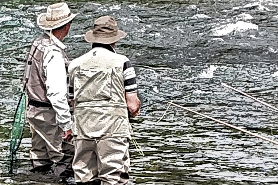 By the river trout fishing instruction, New Zealand