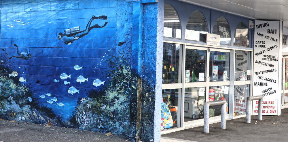 Street art supporting local business, New Zealand