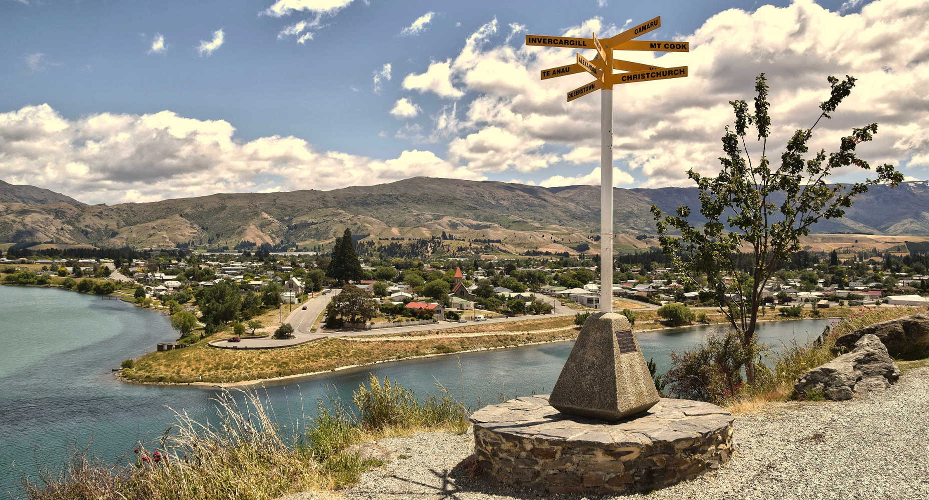 The sign post and Cromwell township at Bruce Jackson Lookout, New Zealand