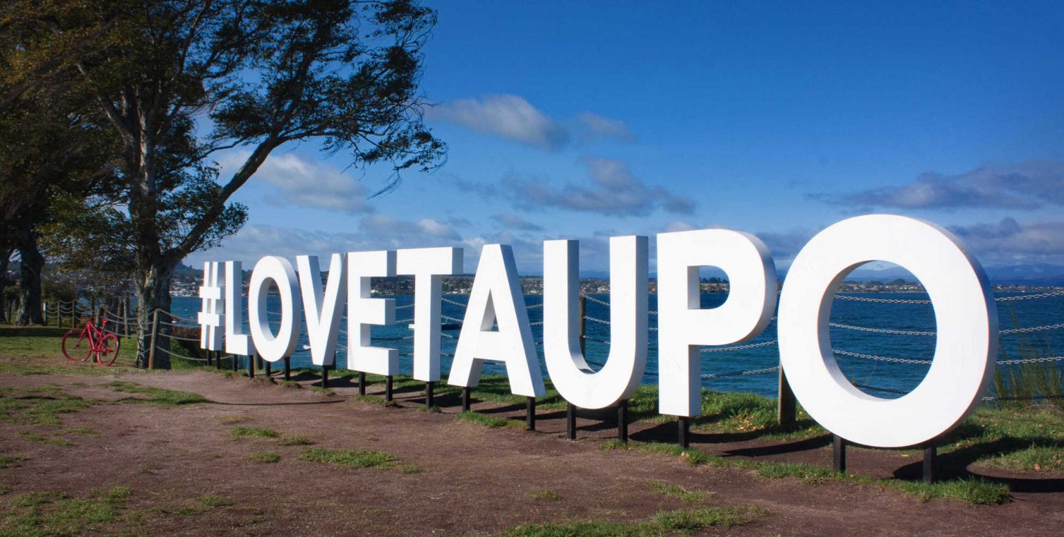 Love Taupo sign on the shore of Lake Taupo, New Zealand