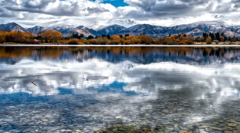 Mackenzie Lake Opuha with the snow capped Southern Alps, New Zealand