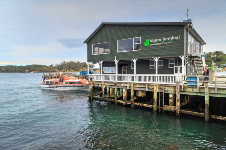 The Horseshoe Bay pier is the point of arrival for most visitors to Oban, a small town on Stewart Island, NZ