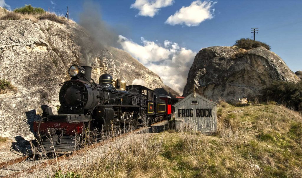 Steam train passing Frog Rock, Canterbury, South Island,New Zealand