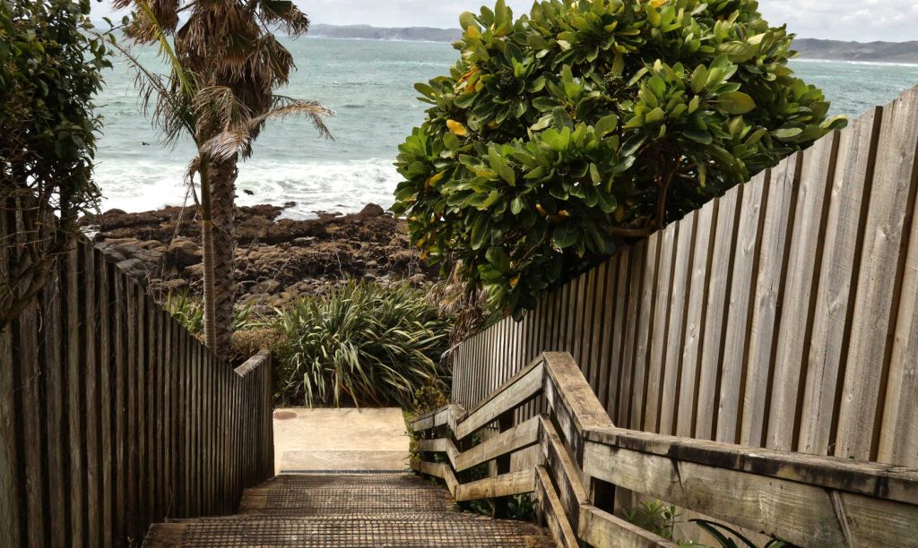 Whale Beach access steps to stony foreshore, Raglan, New Zealand