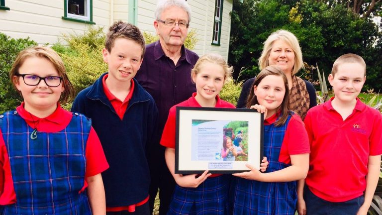 Doug Hutchinson stands with a group of children who formed a conservation group called 'Habitat Heroes' @Jacob McSweeny NZHerald