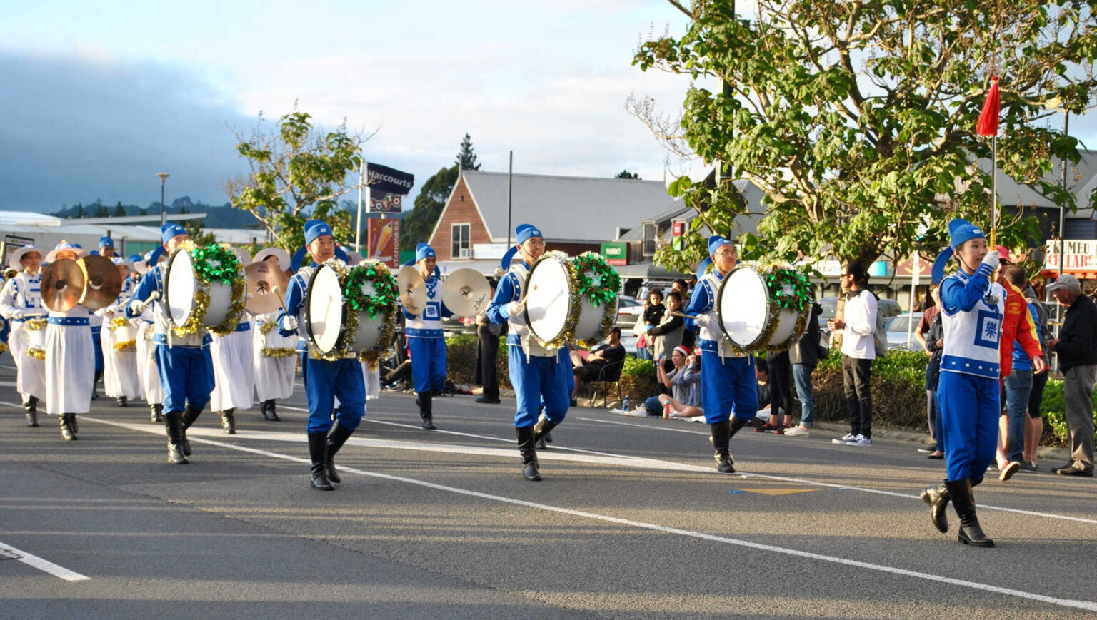 Hari Krishna band marching during a Christmas street parade in Kumeu, Auckland, New Zealand