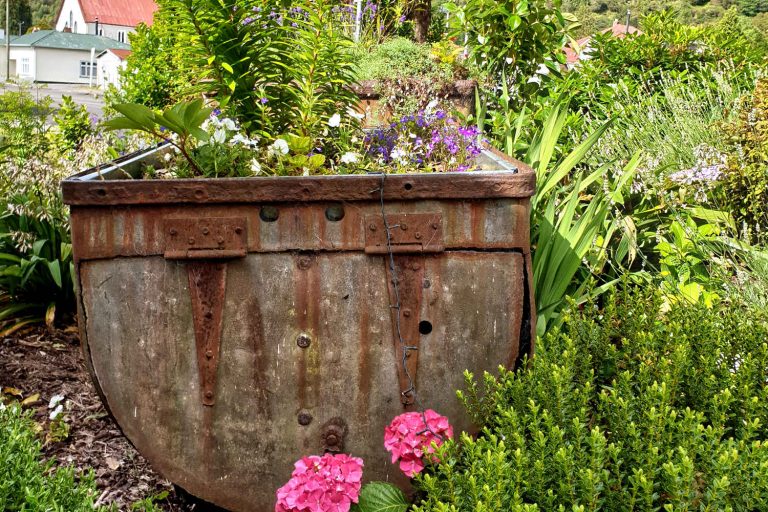 Recycled coal bucket now garden planter, Reefton, New Zealand