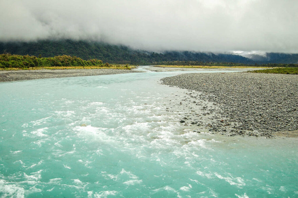Whataroa River under the clouds in the West Coast of New Zealand