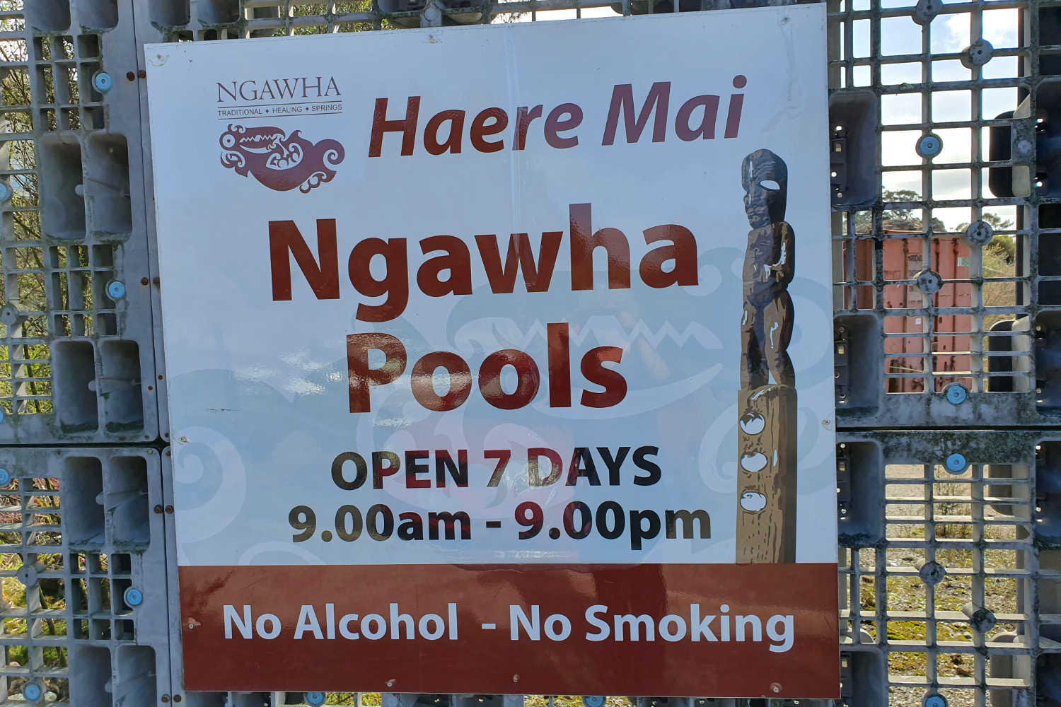Ngawha Hot Pools signage on pallet fencing