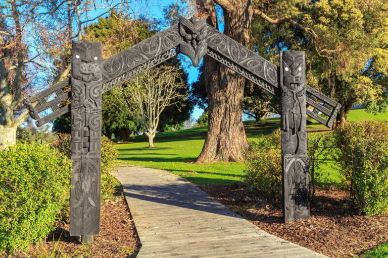 A carved gateway at the site of the Battle of Gate Pa (1864) in Tauranga New Zealand, depicting Tu and Rongo, the Maori gods of war and peace