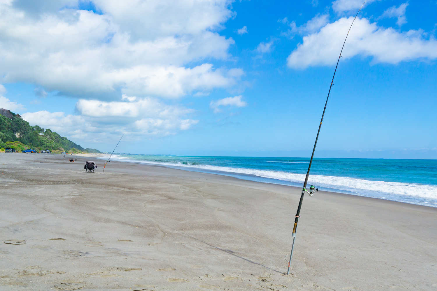 Long sandy beach at Matata in Eastern Bay of Plenty during fishing competition, New Zealand