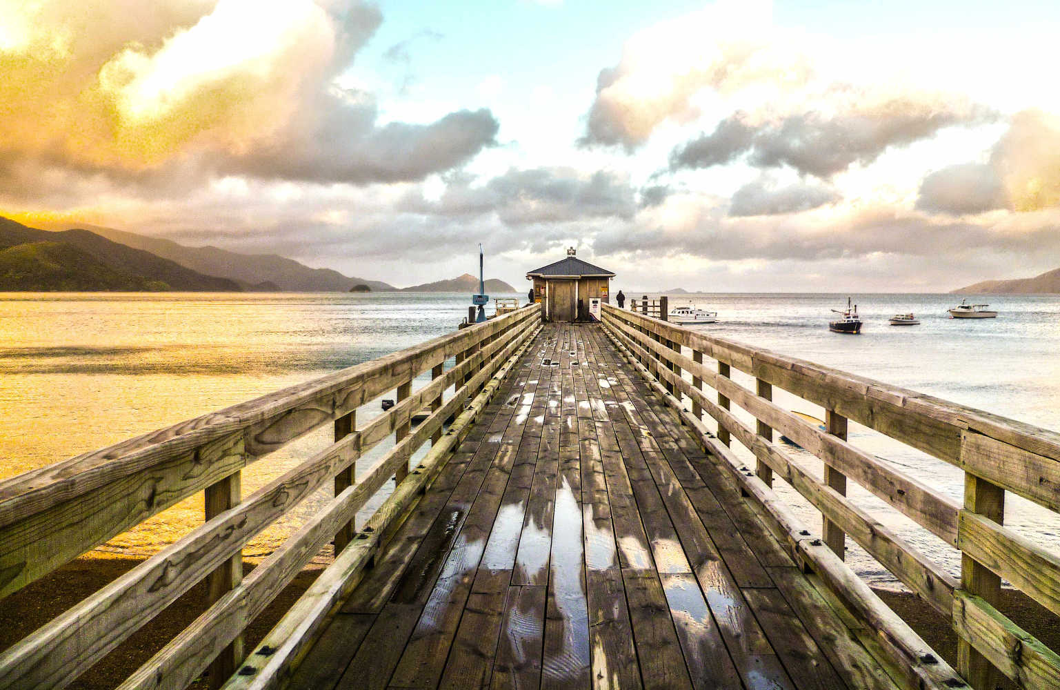 Wooden pier during the sunset in French Pass, Marlborough Sounds, New Zealand