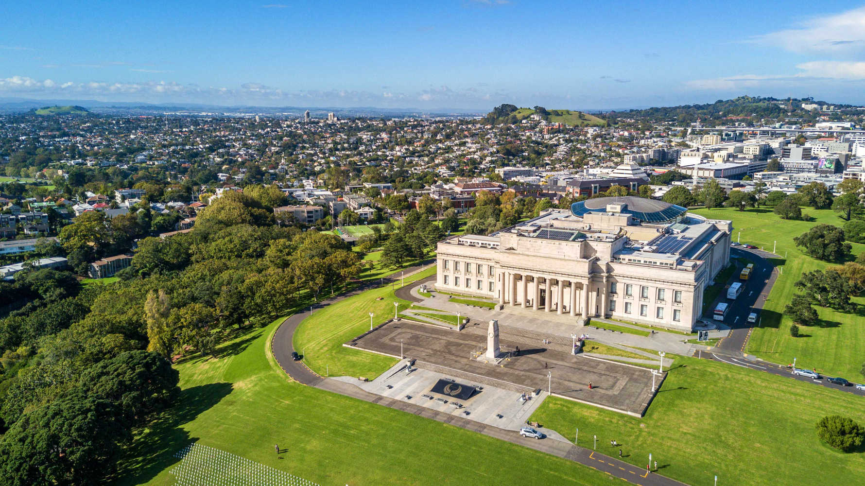 Auckland domain and War Memorial museum with residential suburb on the background. Auckland, New Zealand