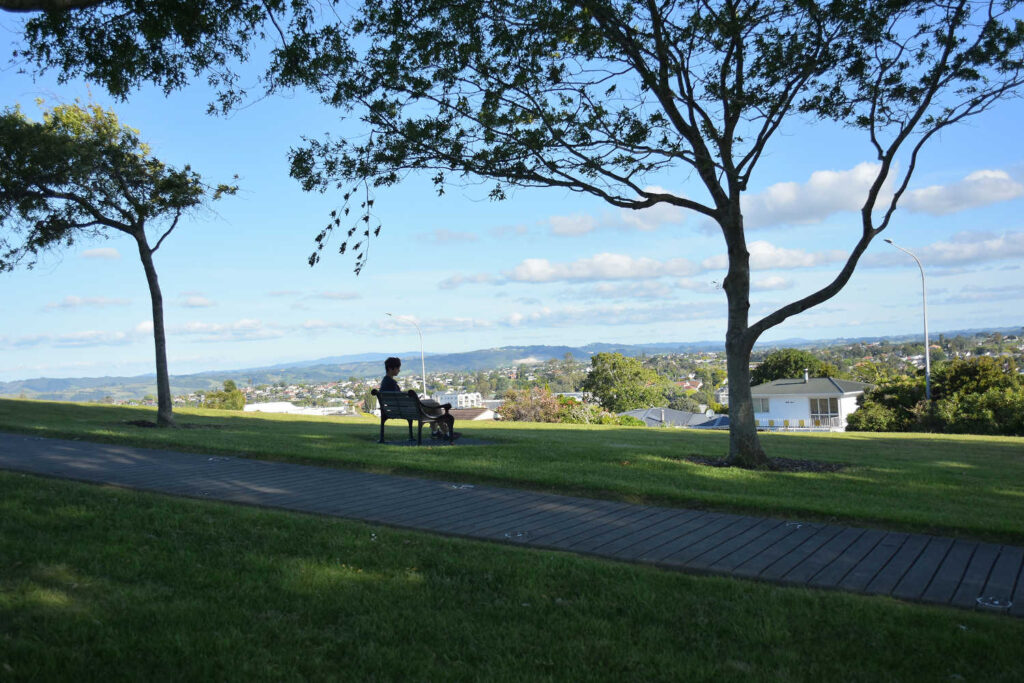 Park bench on top of Stockade Hill overlooking Howick Village, Auckland, New Zealand