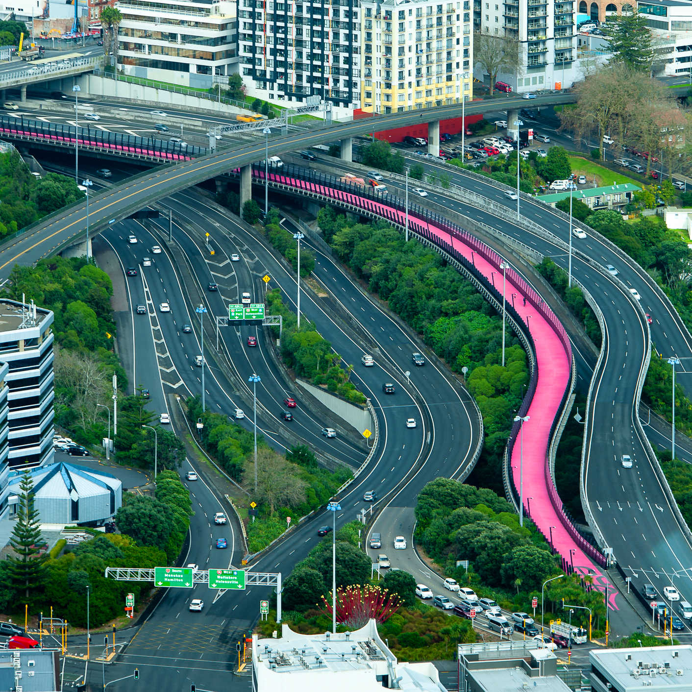Aerial view from the Auckland`s Skytower observation deck to the Nelson Street pink cycleway, named Te Ara (Whiti or Lightpath), New Zealand