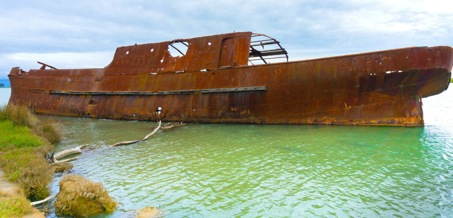 Ship wrecks Scuttled rusting hulk of SS Waverley in shallows of Wairau Lagoons, Marlborough, NZ