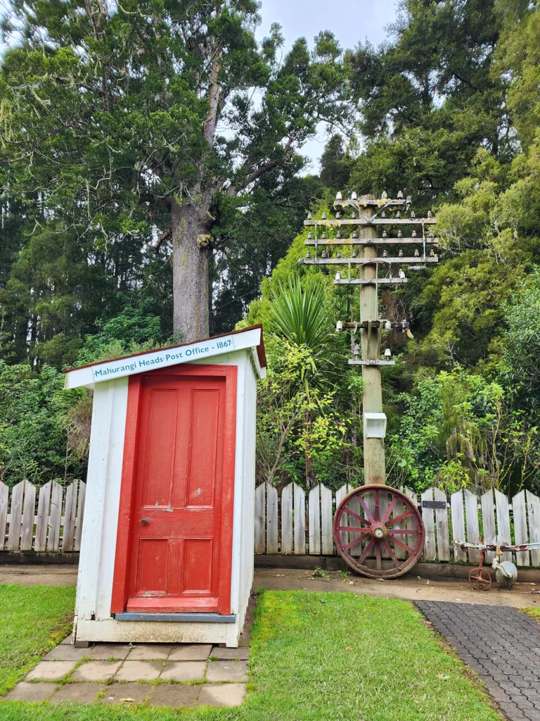 Warkworth tiny Mahurangi Heads original Post Office with massive kauri tree behind Auckland region NZ